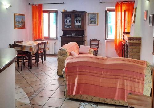 a living room with a couch and a table at Le Maree Susanna in Rio Marina