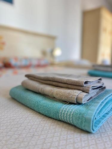 a pile of towels sitting on top of a floor at Agriturismo Vistamare in Orosei
