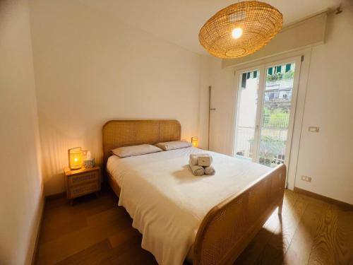 a bedroom with a bed with two stuffed animals on it at Suite Luxury Seaview - Sanremo in Sanremo