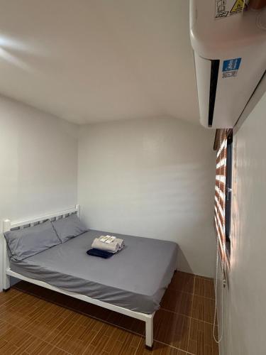 a small room with a bed in the corner at A&F Transient House in San Felipe