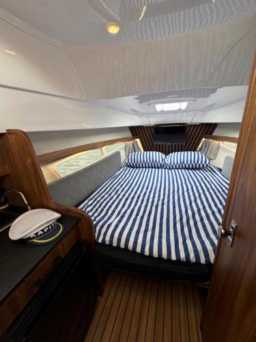 a bed in the back of a boat at Silent Jacht Solina in Polańczyk