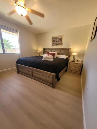 a bedroom with a bed and a ceiling fan at CASA Allegro - Active Vacationers Paradise in Sun City West