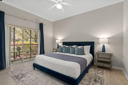 a bedroom with a large bed and a window at Andy's Hideaway at Bahama Bay - Sage Vacations in Kissimmee