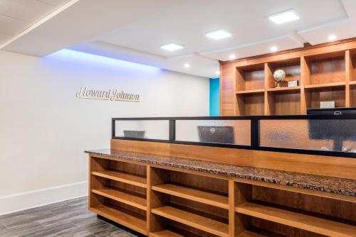 a counter in a store with wooden shelves at Howard Johnson by Wyndham Quincy/ Boston in Quincy