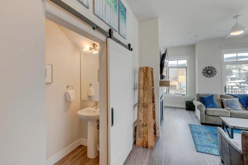 a bathroom with a sink and a toilet in a room at Downtown WP Corner Loft 24 I Hot Tub I Great Views I Bunk Beds I Activity Program in Winter Park