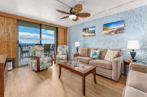 a living room with a couch and a table at Kanai A Nalu 202 in Wailuku