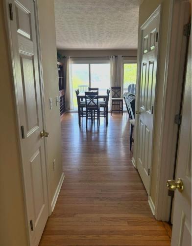 a hallway with a dining room and a table and chairs at High Cotton in Leesburg