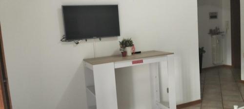 a flat screen tv on a white wall in a room at Adda House in Trezzo sullʼAdda