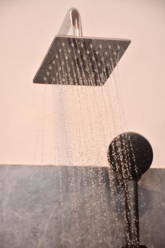 a shower with water coming out of it at Miu Villa in Ahangama