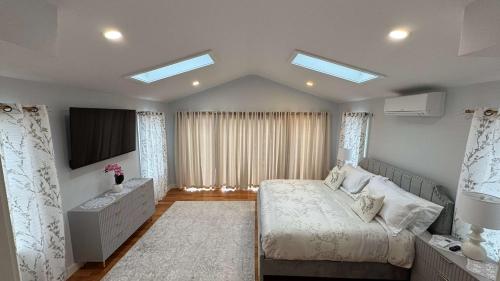a bedroom with a bed and a television in it at The Great Escape in Clintondale
