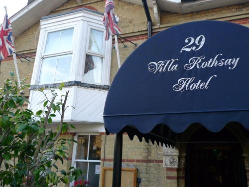 a blue awning in front of a building at Villa Rothsay Hotel in Cowes
