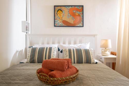 a bedroom with a bed with two towels on it at Eligia home in Angouselianá
