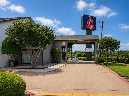 a gas station with a sign in front of it at Studio 6 Suites Mesquite, TX – Gross Rd. in Mesquite