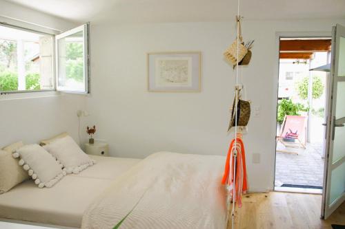 a bedroom with a bed and a swing at #studio 19 in Saint-Léonard