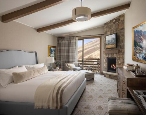 a bedroom with a bed and a fireplace at The Rusty Parrot Lodge and Spa in Jackson