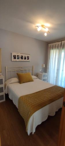 a bedroom with a large bed in a room at Costa de Llanes in Posada de Llanes