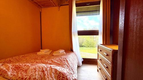En eller flere senge i et værelse på Chalet Edelweiss