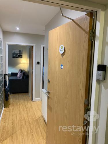 a door leading into a room with a living room at restaway at Hamilton in Doncaster