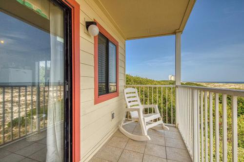 a white chair sitting on the balcony of a house at Plantation East #1201 in Gulf Highlands