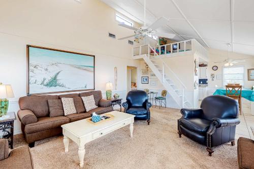 a living room with a couch and two chairs at Fine Fish House in Gulf Highlands