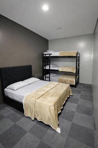a bedroom with two bunk beds in a room at sleep airport congonhas in São Paulo
