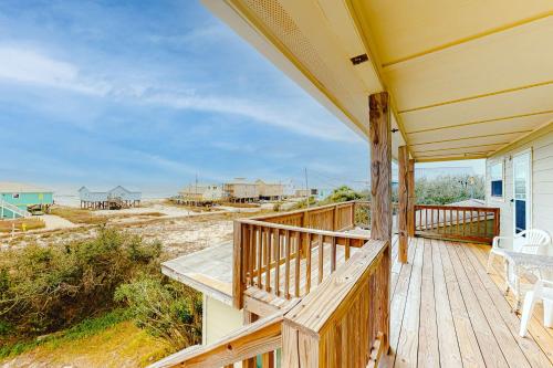 a porch of a house with a view of the beach at Campbellot by Meyer Vacation Rentals in Fort Morgan