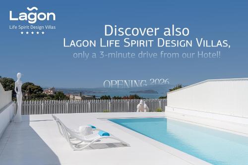 a pool with a lounge chair next to a swimming pool at Lagon Life Spirit Boutique Hotel - Adults Only in Chania