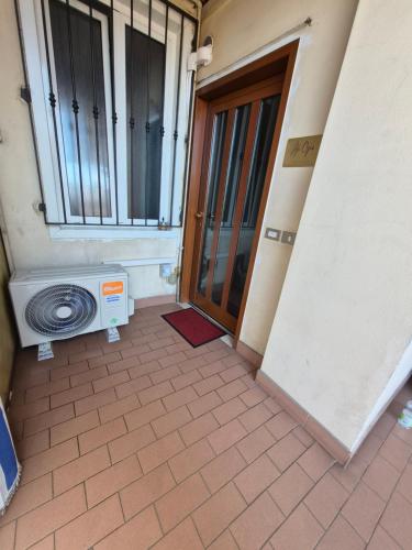 an entrance to a building with a washing machine and a door at Ali Gio in Alzano Lombardo