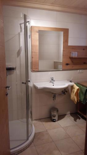 a bathroom with a sink and a shower at Apartment Urstöger in Gosau