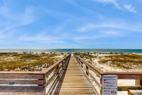 a wooden boardwalk leading to the beach at Plantation East #2310 in Gulf Highlands