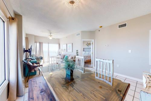 a living room with a couch and a table at Tidewater 601 in Orange Beach