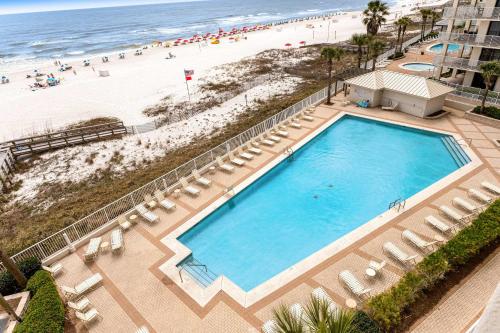 an overhead view of a swimming pool and the beach at Pelican Pointe 302 in Orange Beach