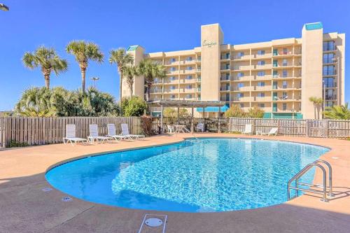 a swimming pool in front of a hotel at Wind Drift 311S in Orange Beach