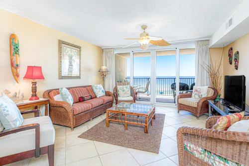 a living room with a couch and chairs and a television at Wind Drift 311S in Orange Beach