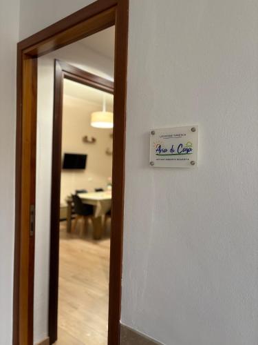 a door with a sign that reads age and care at Aria di Casa in Calatafimi