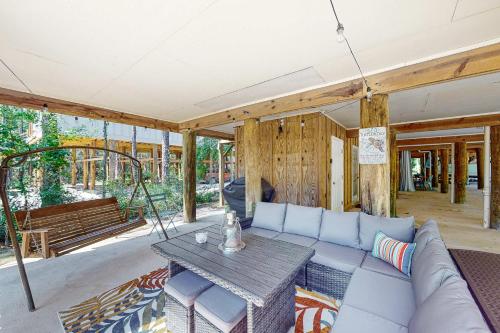 a living room with a couch and a table at Sunset Breeze #4 in Dauphin Island