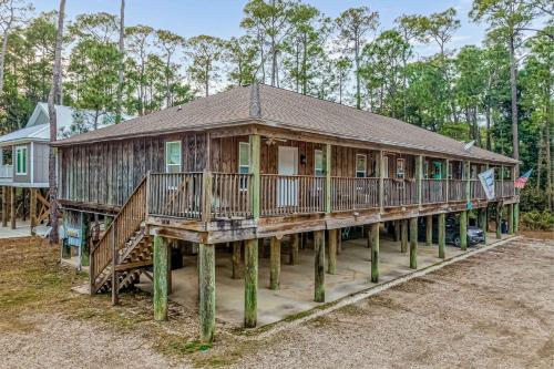a large wooden house on stilts at Sunset Breeze #4 in Dauphin Island