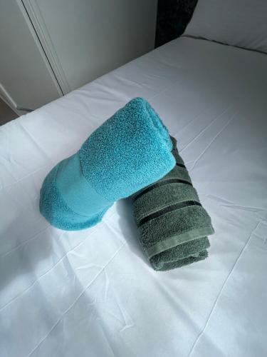 a blue sock sitting on top of a bed at Mayfair hotel Blackpool city centre in Blackpool