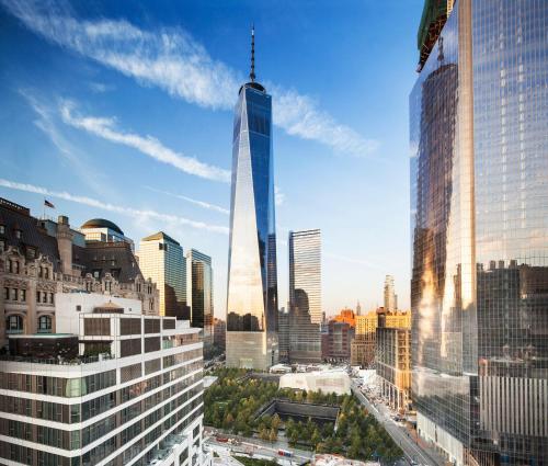 a rendering of a tall skyscraper in a city at The Washington Hotel NYC in New York