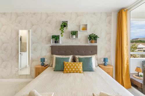a bedroom with a large bed and a window at Magic View Costa Adeje in Costa de Adeje