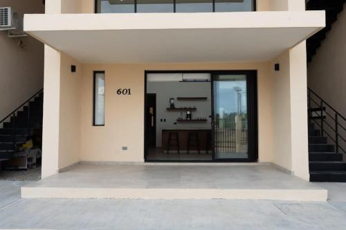 a front door of a house with the word god on it at Modern 2BR Condo Close to Downtown Cabo in Cabo San Lucas