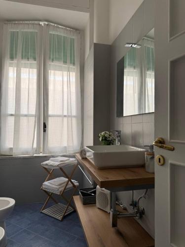 a bathroom with a sink and a mirror at Mary 's Home in Caserta