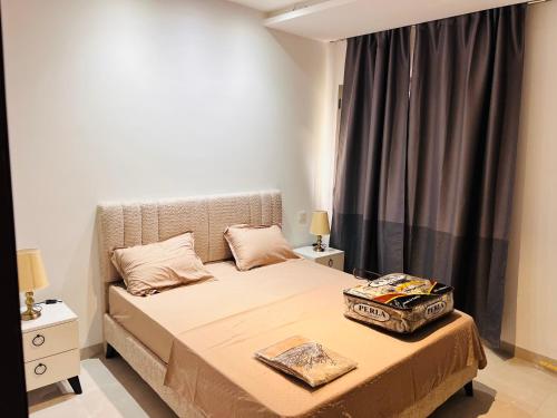 a bedroom with a bed and a window at Modern Oasis near Airport & Lac 2 - Wahat Aouina in El Aouina Station