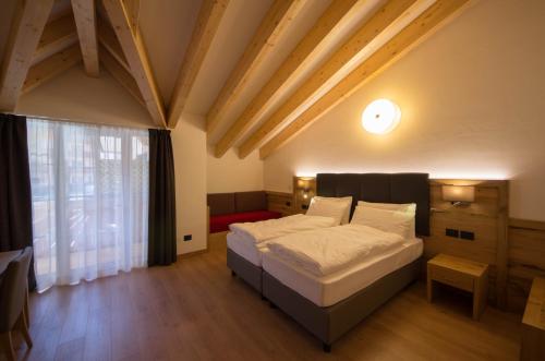 Postel nebo postele na pokoji v ubytování Residence Meridiana