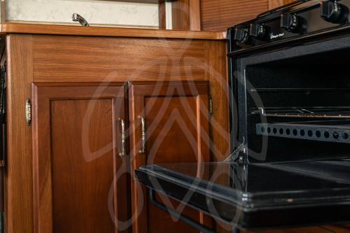 a black microwave oven sitting in a kitchen at MUUN experience in Ciudad del Carmen