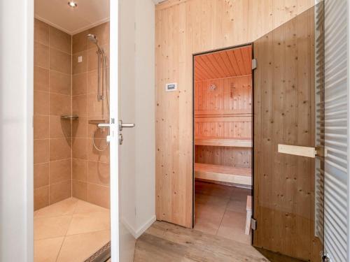 a bathroom with a shower and a walk in shower stall at Dune Design 38 in Colijnsplaat