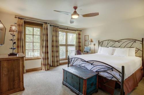 a bedroom with a bed and a ceiling fan at Beaver Creek Village by Vail Resorts in Avon