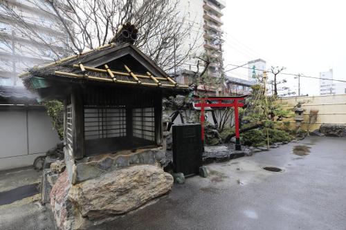 a small building on the side of a street at Wakamatsu Hot Spring Resort in Hakodate