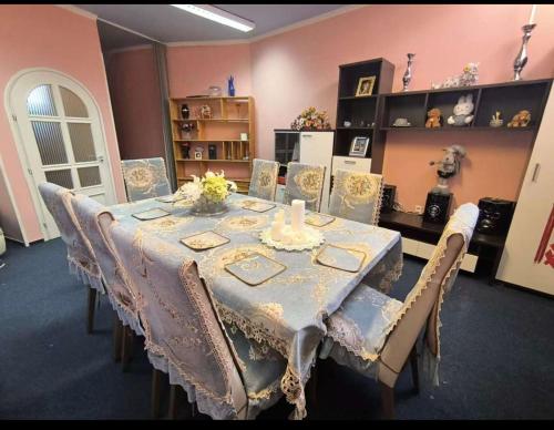 a dining room with a table and chairs at Panorama Hills Villa in Budapest