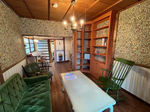 a living room with a couch and chairs and a table at 十度-jude- in Osaka